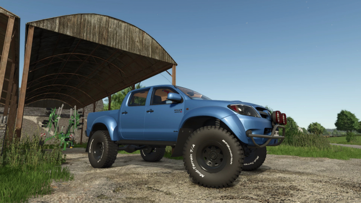 fs25-mods, Toyota Hilux AT38 mod in Farming Simulator 25, showcasing a blue pickup with off-road tires.