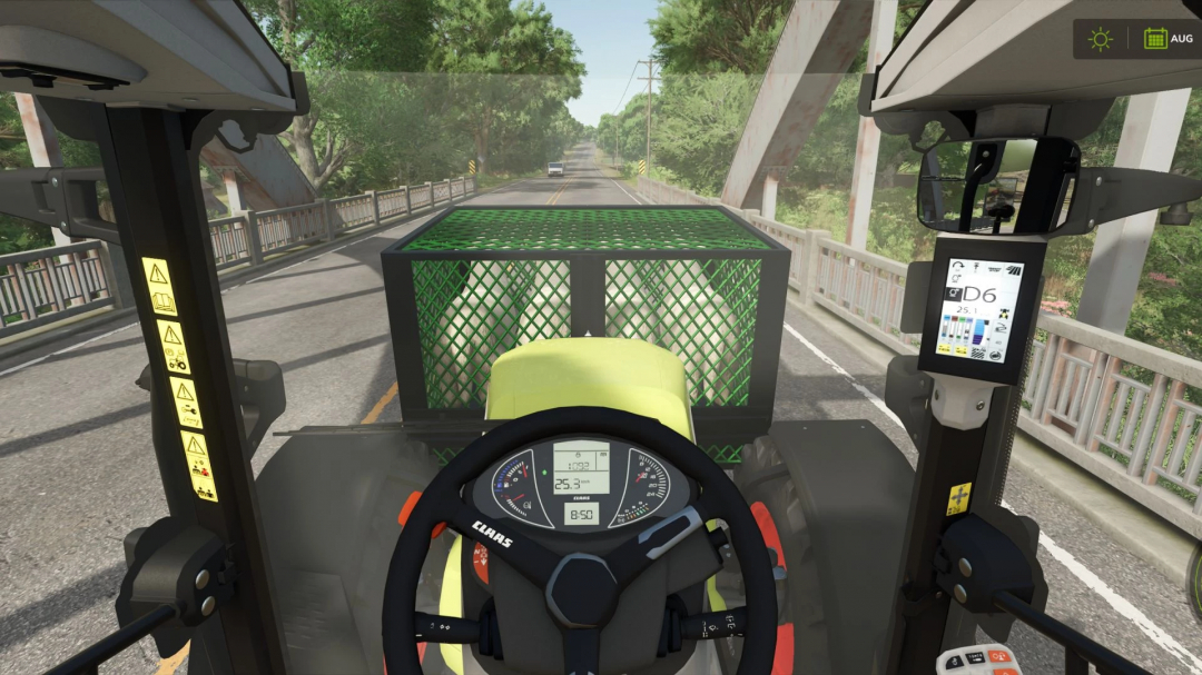 View from a tractor in Farming Simulator 25, showcasing the Animal Transport Box mod on a road. FS25 mods enhance gameplay.