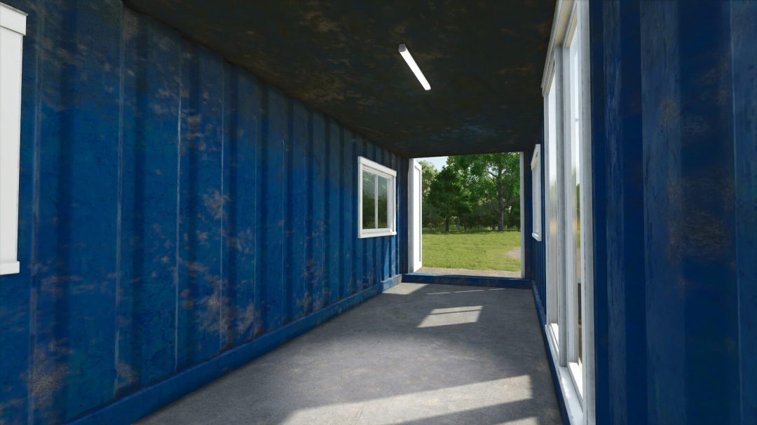 Interior of blue container farmhouse mod in FS25, showing windows and open end with outdoor greenery.