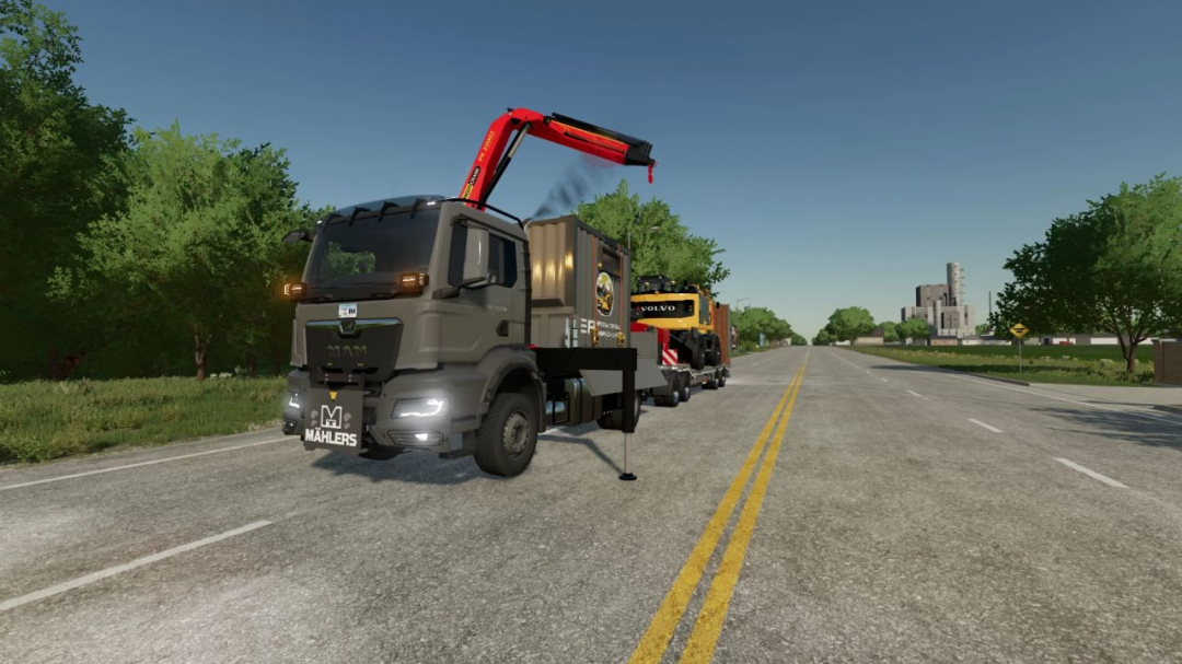 FS22 MAN TGS 2021 4x4 mod in Farming Simulator 22 on a road with crane equipment.