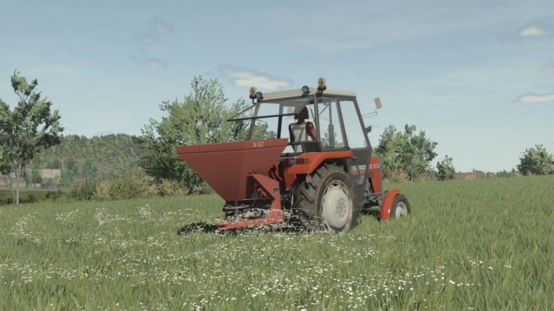 FS25 Agromet Brzeg N-022 mod in Farming Simulator 25, showing a tractor spreading fertilizer on a green field.