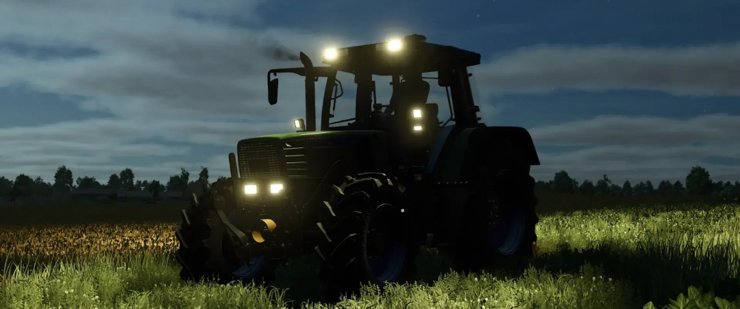 Fendt 500 Favorit v1.0.0.0 mod tractor with headlights on in a field at night, FS25 mod.