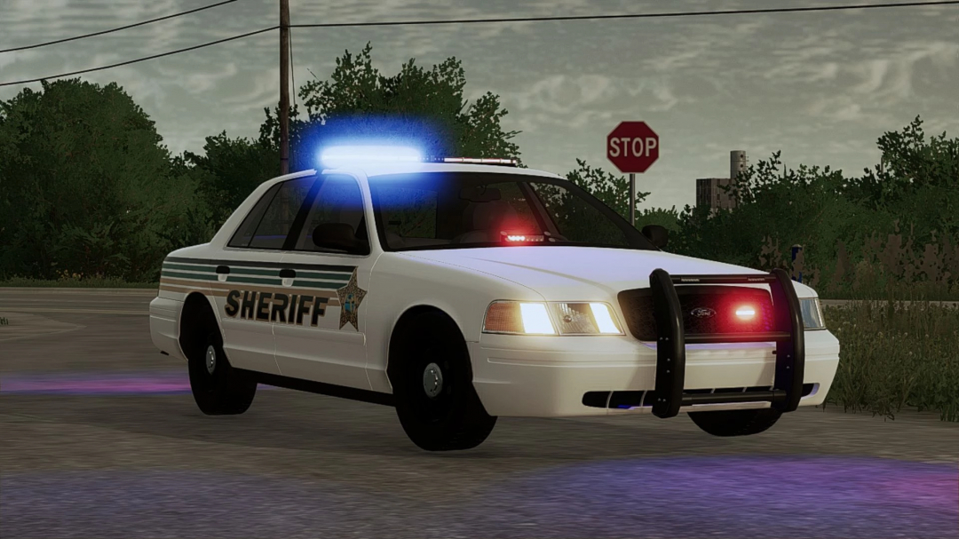 Ford Crown Victoria Police Interceptor mod for FS25 with flashing lights on a rural road.