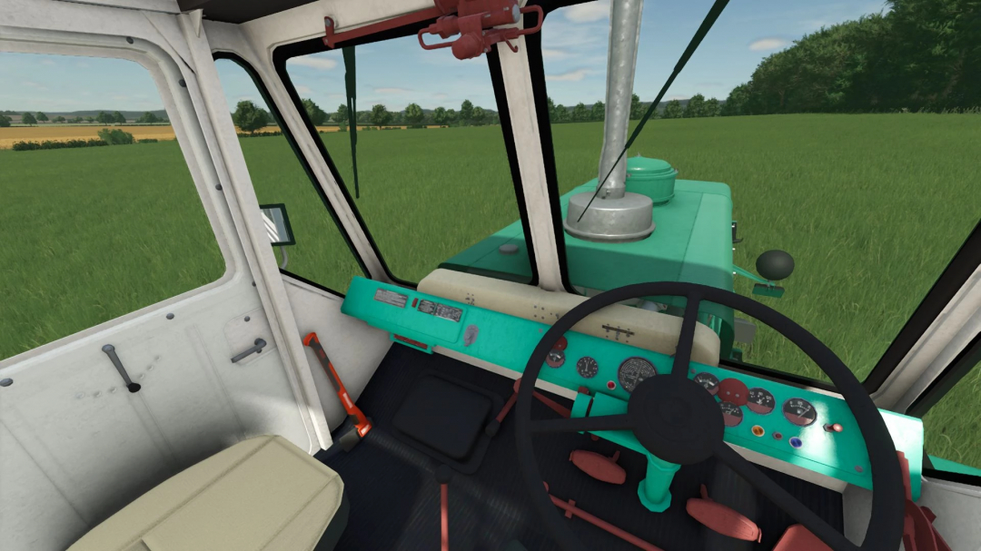 Interior view of HTZ T-150K tractor in FS25 mod, showcasing dashboard and steering in a virtual green field.