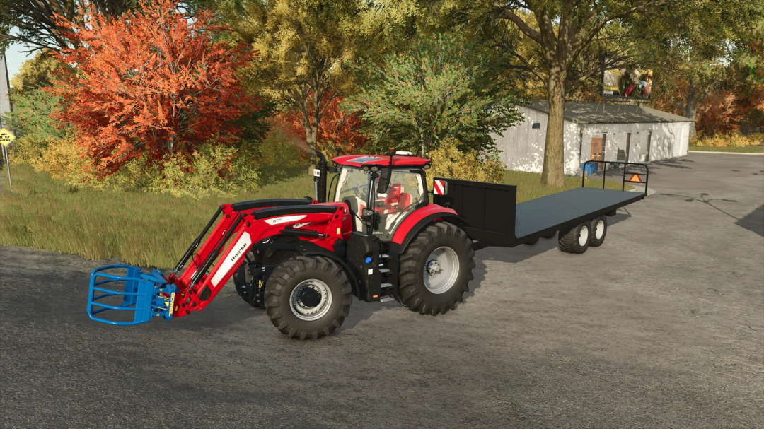 A red tractor with a blue bale grabber attached to a homemade bale trailer in FS25 mod, surrounded by autumn trees.