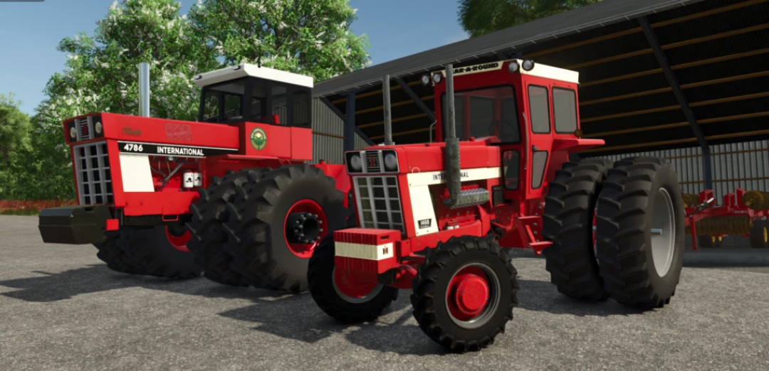 FS25 mods image showing two red International tractors, model 1468, parked near a barn in Farming Simulator 25.