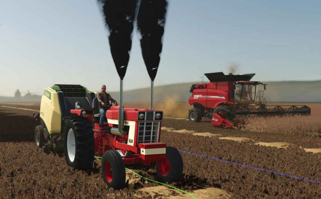 FS25 mod International 1468 v1.0.0.0, a red tractor on a farm field with a baler, and a red harvester in the background.