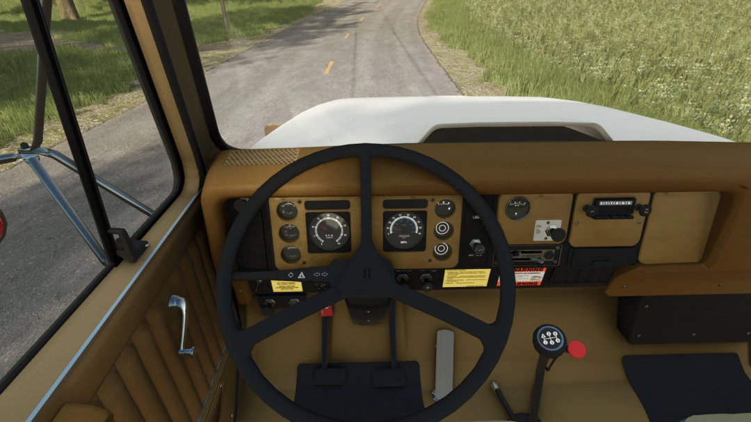 Interior view of International S1800 Grain Bed mod dashboard in FS25, showing steering wheel and gauges.