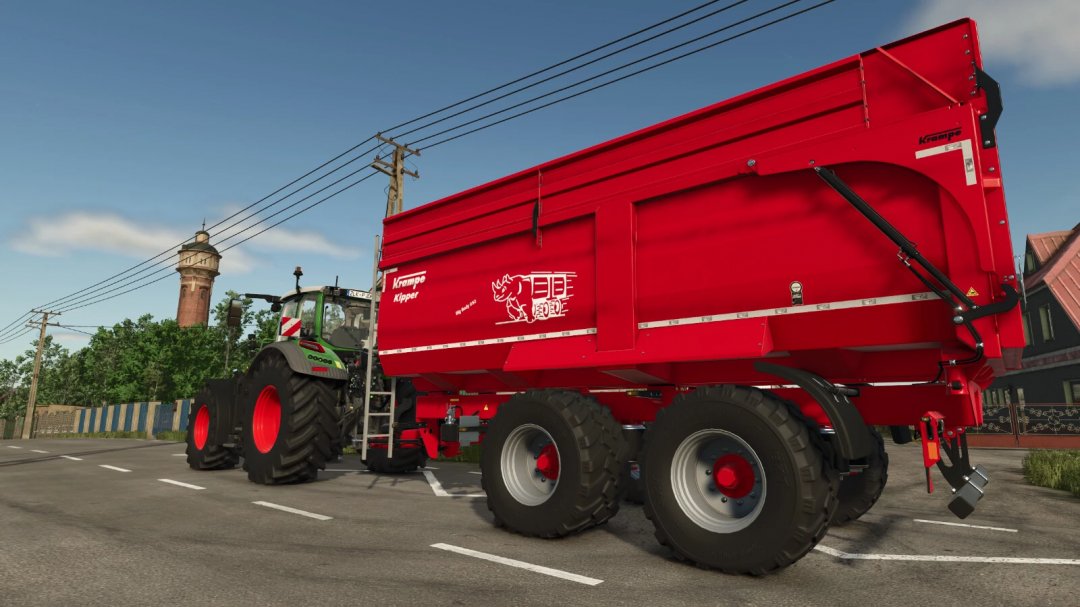 Krampe Big Body 650 mod in FS25, showcasing a red trailer attached to a tractor on a rural road.