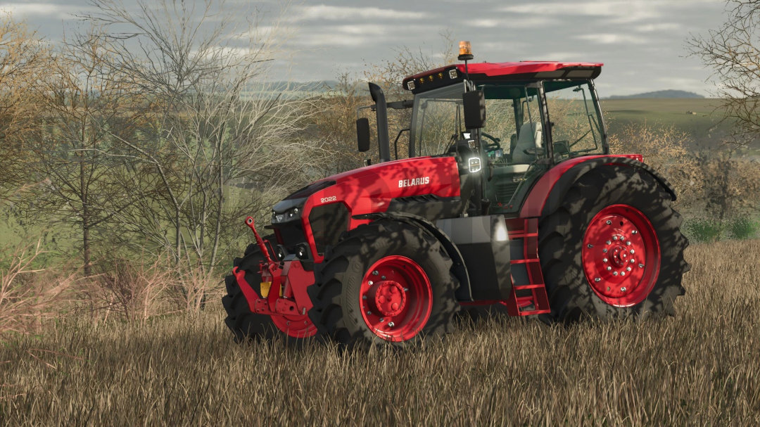 FS25 mod MTZ BELARUS 2022.7 v1.0.0.0 tractor in a grassy field.