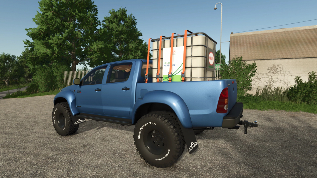 Toyota Hilux AT38 mod in blue with large tires and herbicide tank, for FS25.