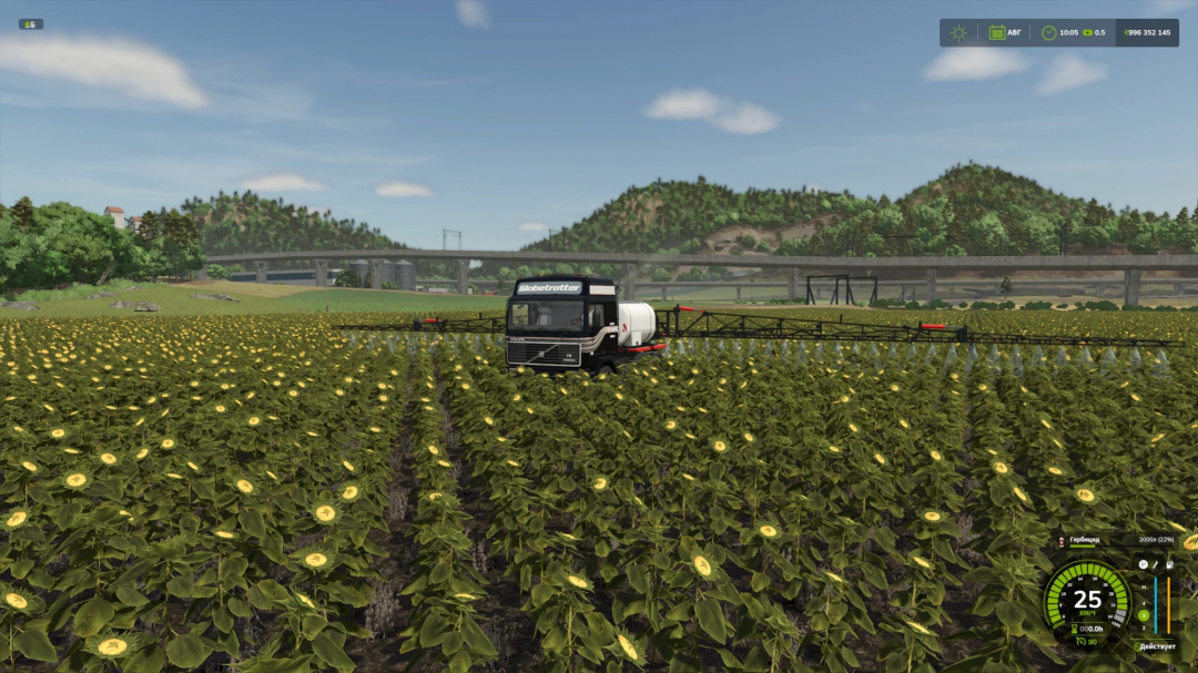 Volvo F16 mod in FS25 spraying a sunflower field under a clear sky.