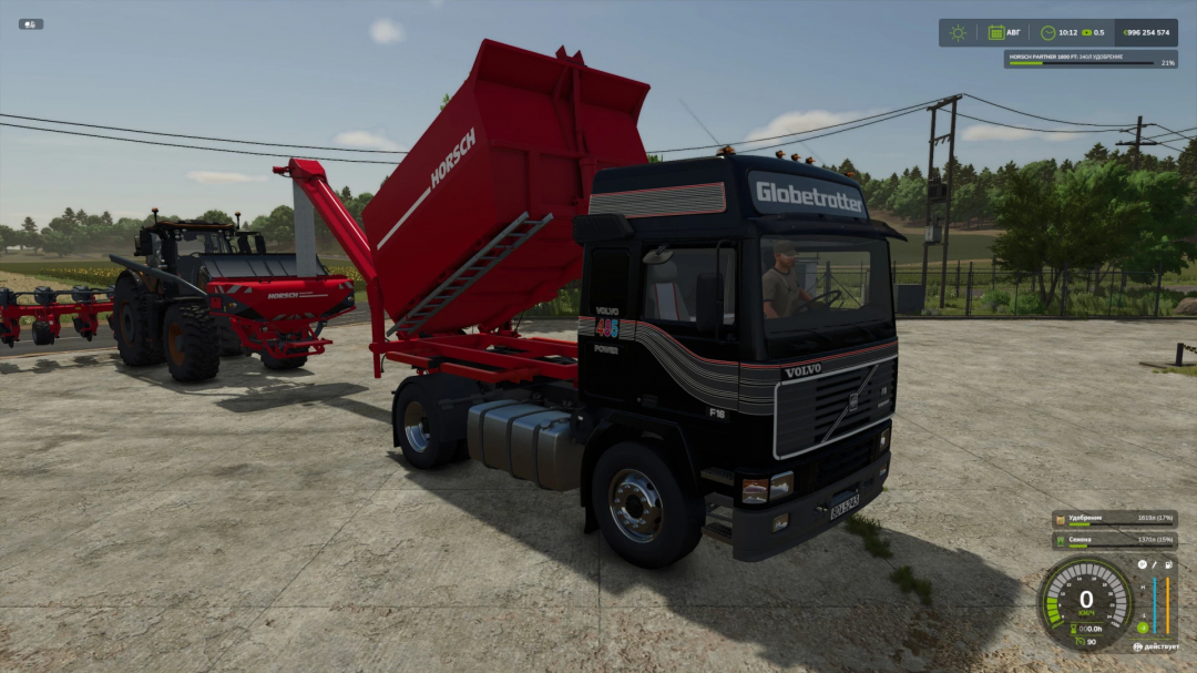 Volvo F16 mod in FS25, featuring a black truck with a red trailer, parked on a farmyard. Farming Simulator 25 mods enhance gameplay.