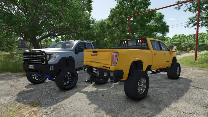 fs25-mods,  FS25 mods showcase: Two 2020 GMC Sierra Denali AT4 trucks parked on a rural road.