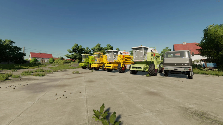 fs22-mods, FS22 CLAAS combine harvesters Pack v1.5.0.0 displayed in Farming Simulator 22 mod showing diverse models on a sunny day.