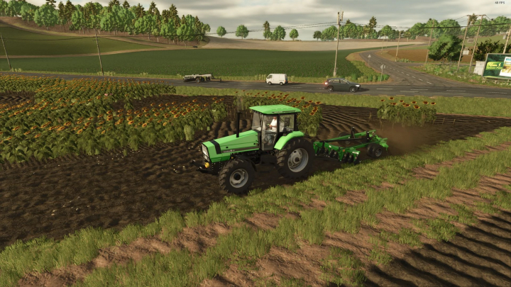 fs25-mods,  FS25 mod Grade 18x24 discos BR v1.0.0.0 showing a tractor plowing a field with sunflowers nearby.