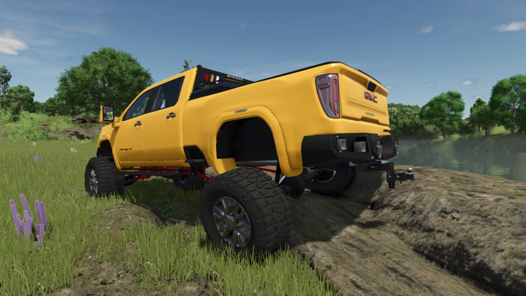 2020 GMC Sierra Denali AT4 mod in Farming Simulator 25, yellow truck on grassy terrain.