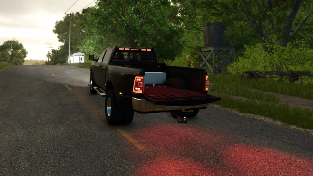 2024 Dodge Ram 3500 CrewCab mod for FS25 with open tailgate on a rural road.