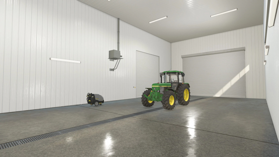 Interior of American Midwest Maintenance Shop mod in FS25 with a green tractor, showcasing the spacious garage setup.