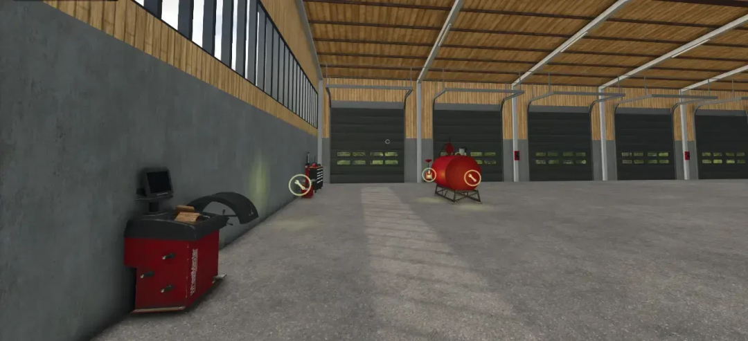 Interior of AustriaModding drive-through hall in FS25 mod, featuring equipment and large doors.