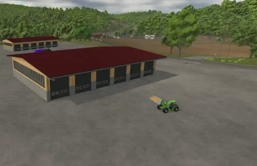 FS25 AustriaModding drive-through hall big mod showing large red-roofed garages with forest backdrop.