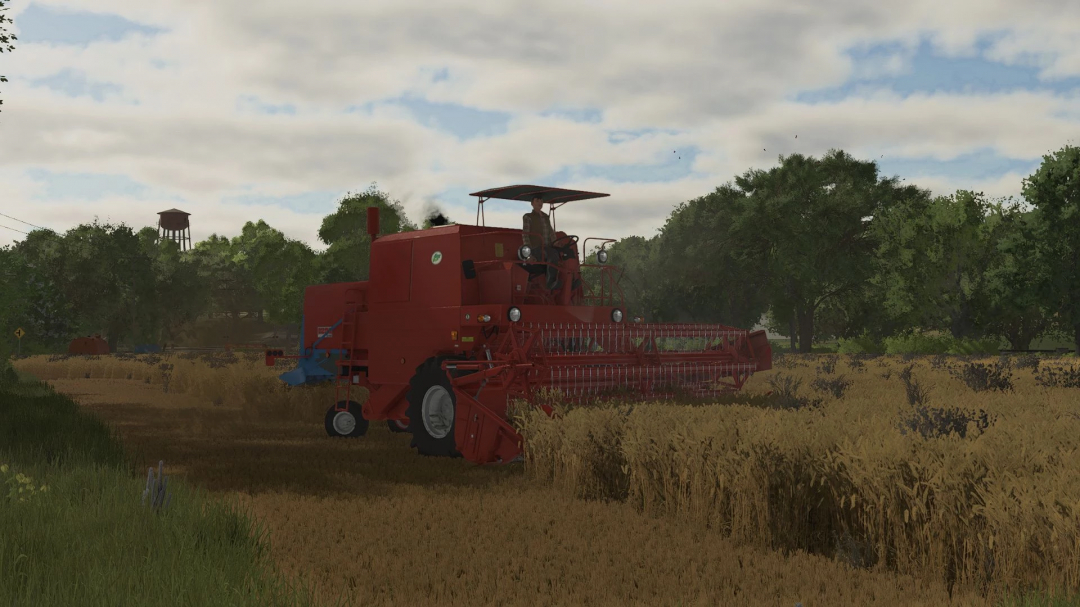 A red Bizon Z056 combine harvester in a wheat field in FS25 mod. Trees and a water tower in the background.