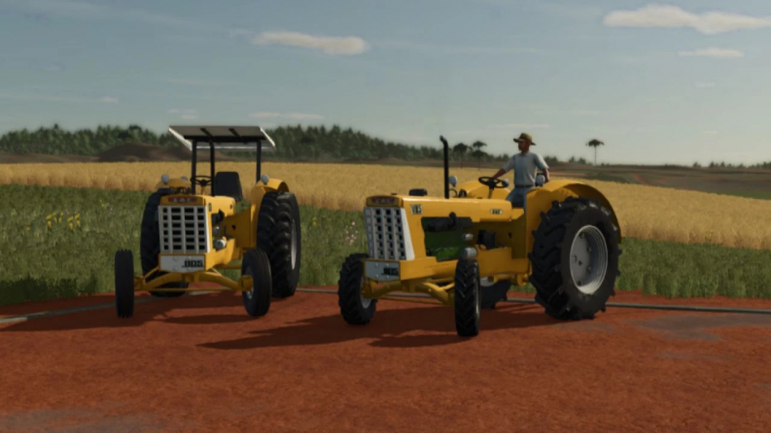 Two yellow CBT 1105 BR tractors in a field in Farming Simulator 25 mod.