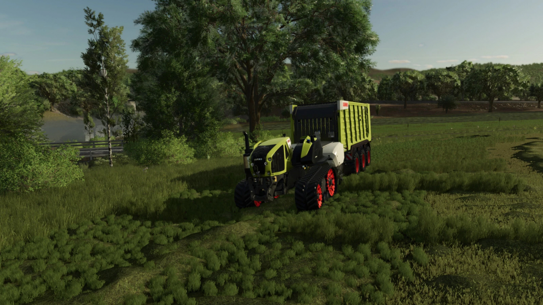 Claas AXION 930PTT tractor mod in Farming Simulator 25 driving through a lush green field.