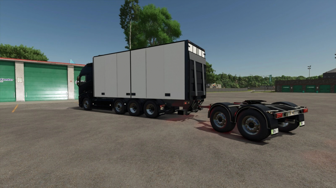 FS25 Dolly HcT v1.0.0.0 mod showcasing a white trucking trailer with a dolly attachment in Farming Simulator 25.