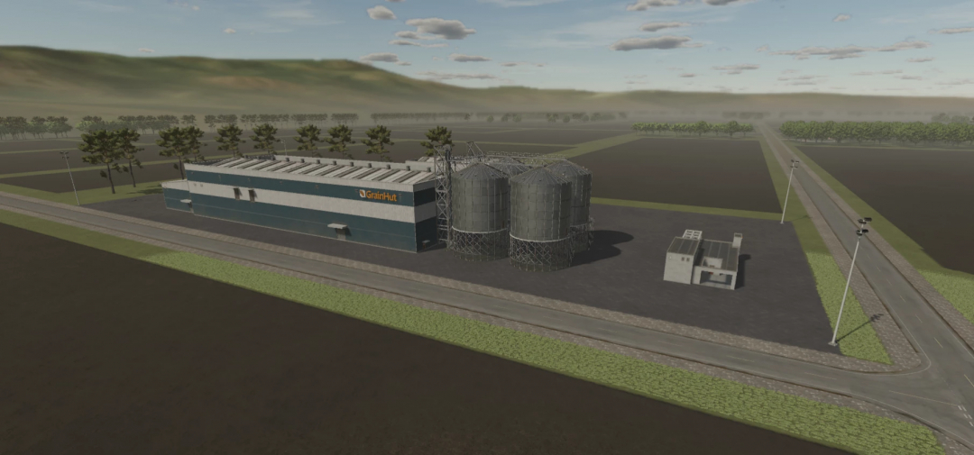 FS25 US Flatlands 4X v4.3 mod image featuring a large grain storage facility with silos and a warehouse in Farming Simulator 25.