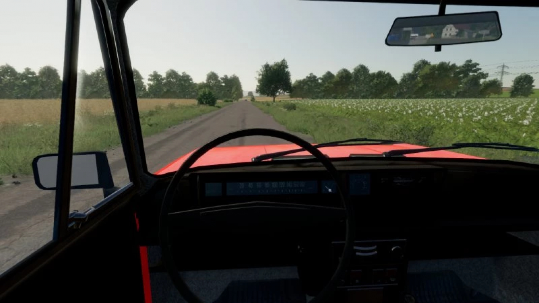 Interior view of Fiat 125p mod in FS22, showcasing steering wheel and dashboard on a rural road.