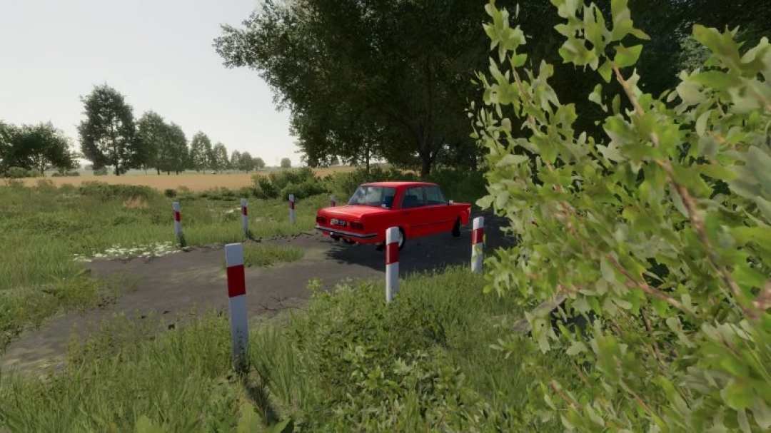 Fiat 125p car parked on a rural road in FS22 mod, surrounded by trees and greenery in Farming Simulator 22.