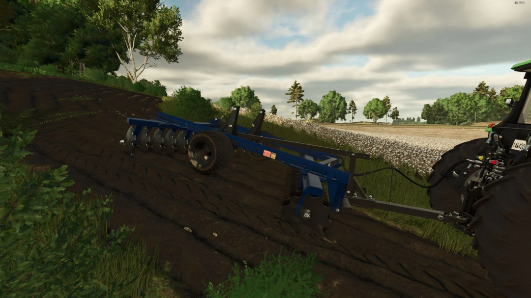 FS25 mod Grade 18x24 discos BR v1.0.0.0 in action on a plowed field with a tractor in Farming Simulator 25.