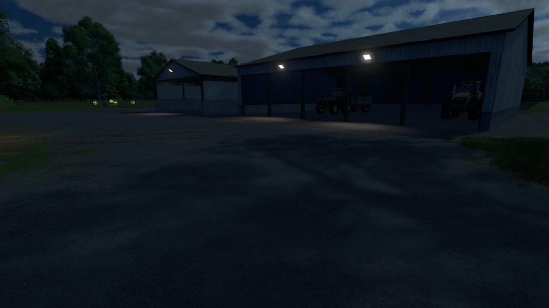 Night view of Machinery Garage v1.0.0.0 mod in FS25, featuring illuminated tractors inside the garage.