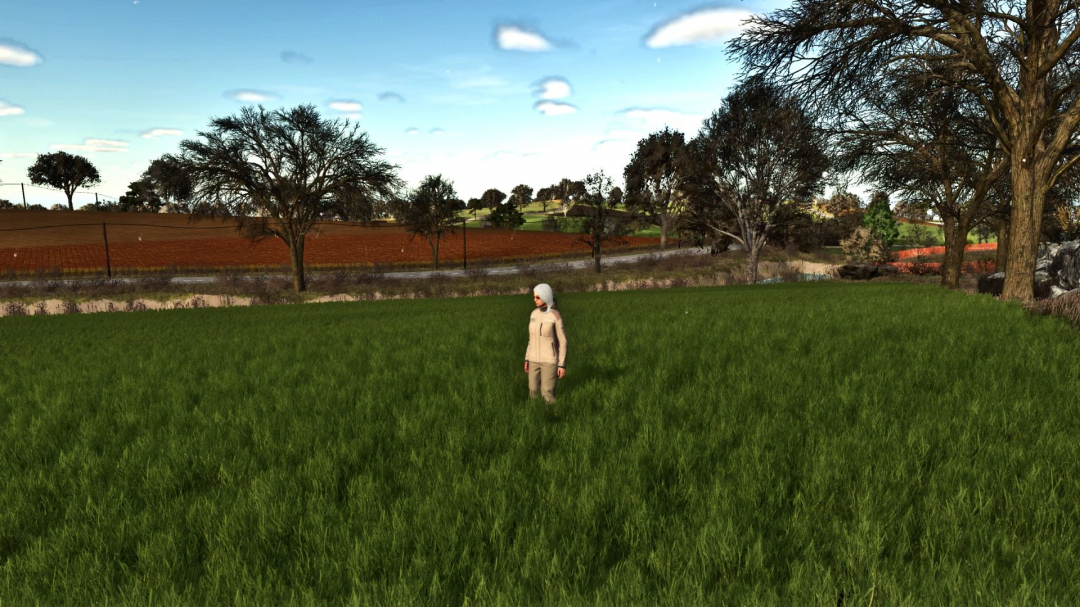 Character standing in lush green grass field, showcasing FS25 mod 'More beautiful grass' with scenic landscape.