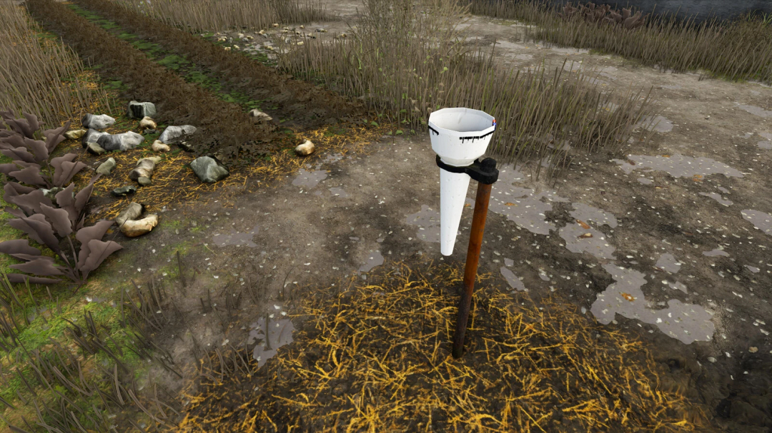 Rain Gauge mod in FS25 showing a measuring device in a field.