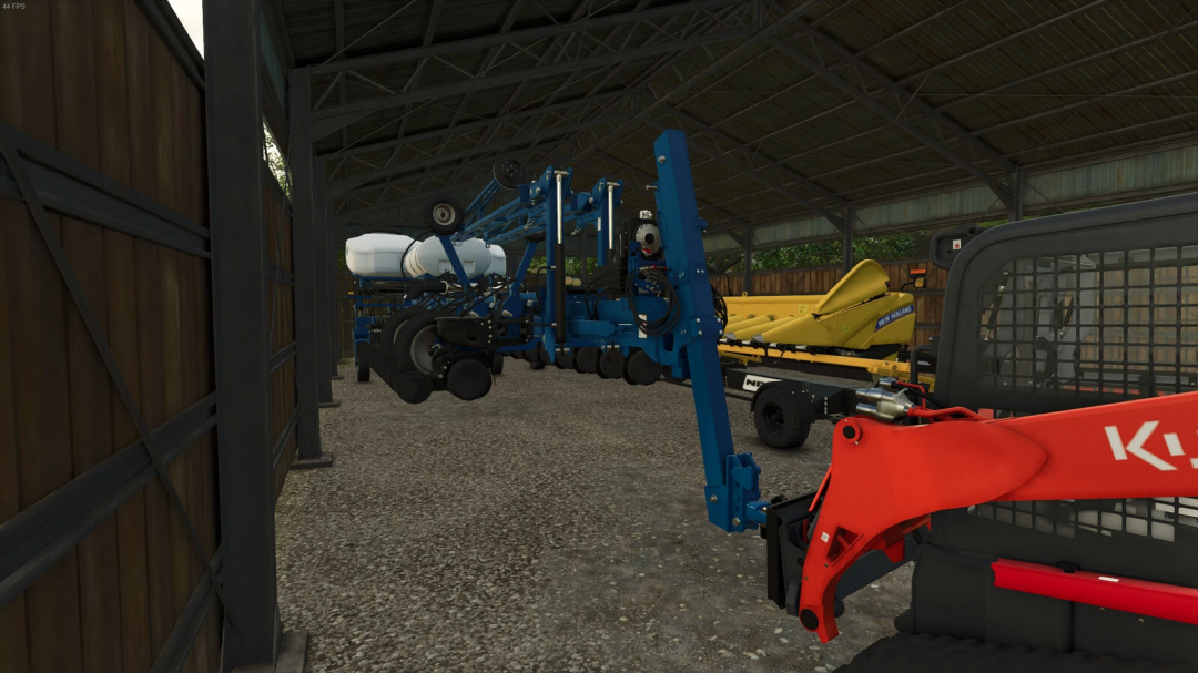 FS25 mod Skid Steer Bumper Hitch Adapter v1.0.0.0 in farm shed with equipment.