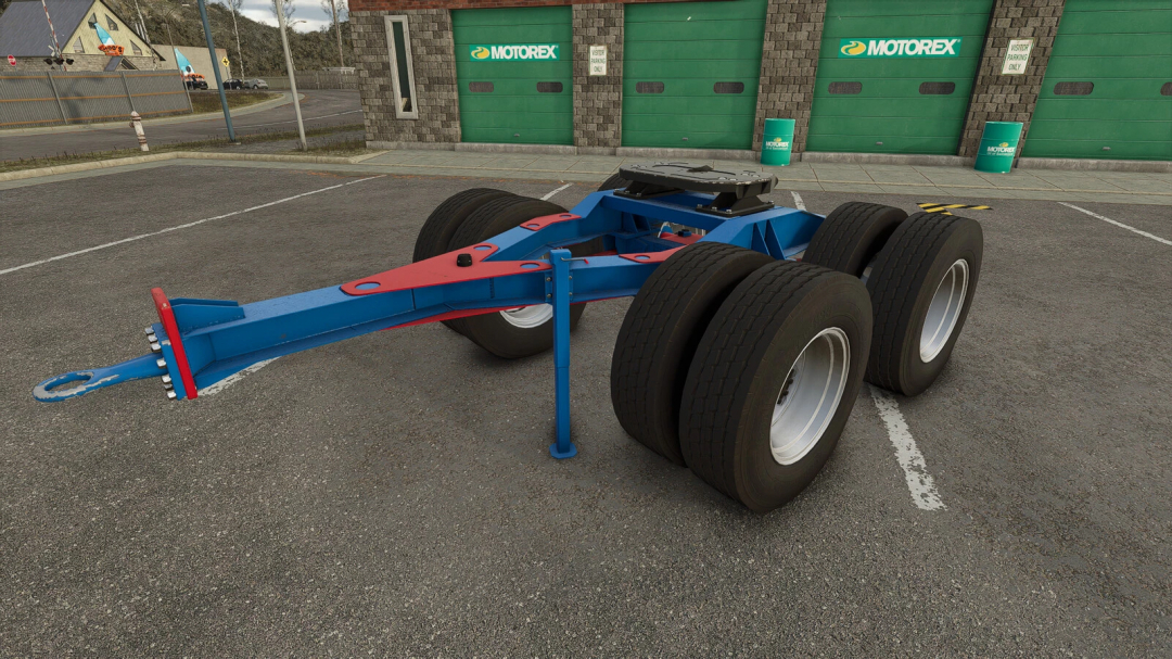 Tonar-PTT trailer mod for FS25 parked in front of green garage doors.