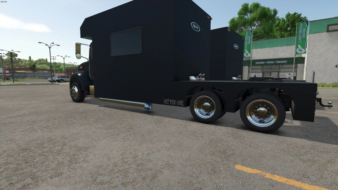 Toter HOME HAULER mod in FS25 shown in a parking lot, showcasing its design and wheels.