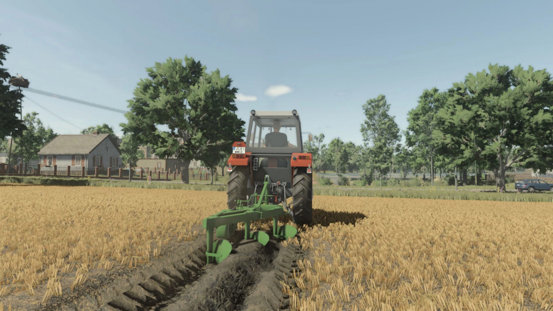 FS25 mod Unia U-022-25/1 Pack v1.0.0.0 in action, showing a tractor plowing a field with trees and a house in the background.