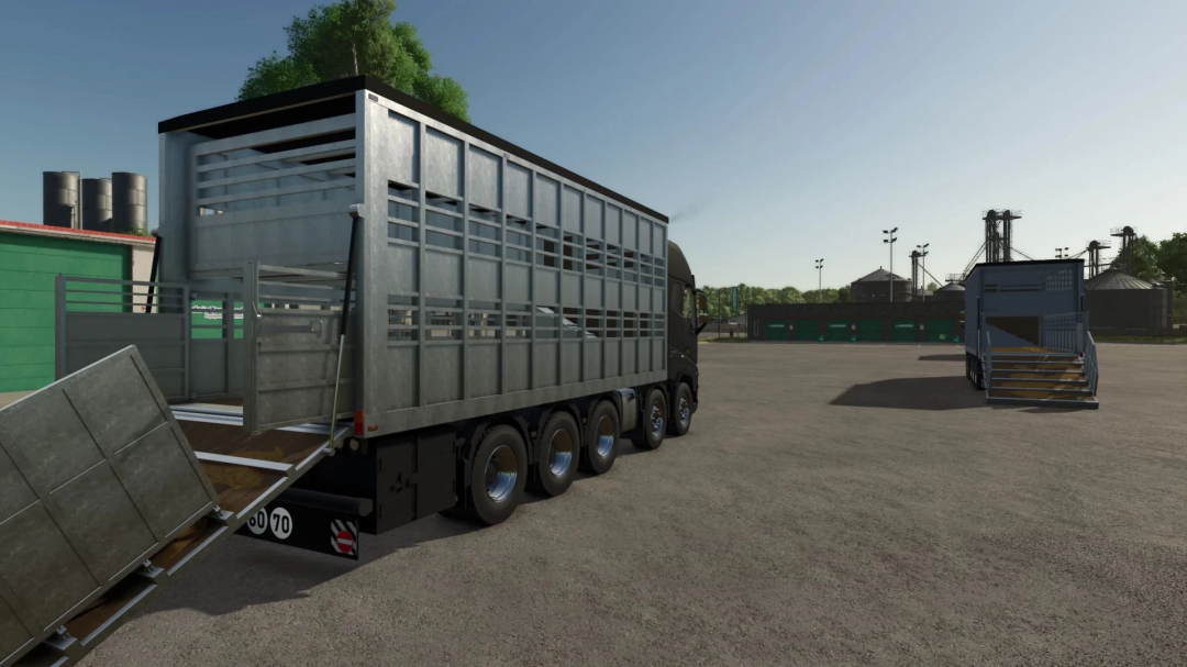 FS25 mod Volvo animal transport truck with ramp in farming environment.