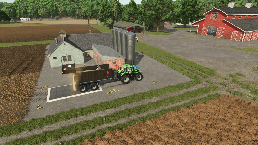 FS25 mods: Wholesale mod v1.0.0.0 - Tractor unloading at farm silos, Farming Simulator 25 scene.