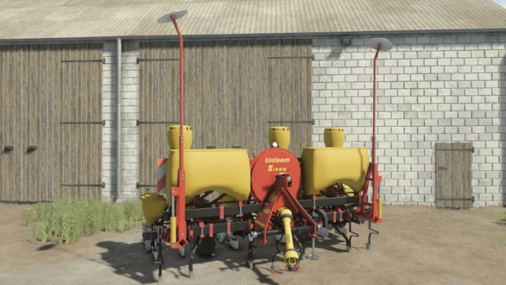 fs25-mods,  FS25 Rau Unisem MS4/MS6 mod in Farming Simulator 25, showing yellow and red equipment in front of barn.