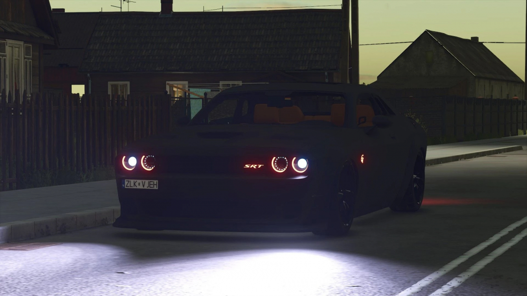 Dodge Challenger Hellcat mod in FS25, showcasing headlights and sleek design, set in a dimly lit street scene.