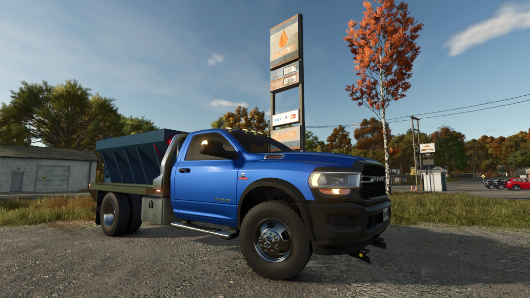 Blue Dodge Ram 5500 mod in FS25 parked near a service station, showcasing Farming Simulator 25 mods.