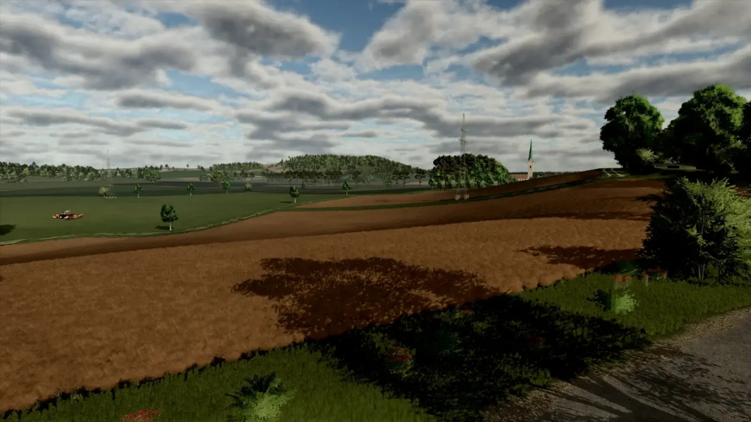 Scenic farmland landscape in FS25 Oltenbug mod, showcasing fields and trees under a cloudy sky.