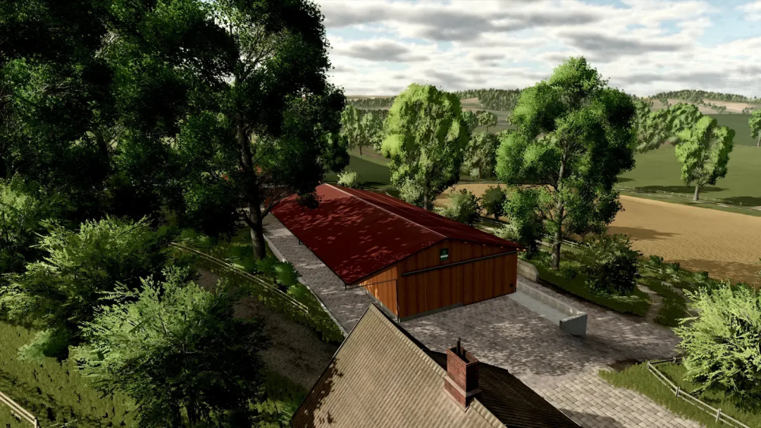 Scenic view of FBM25 Oltenburg mod in FS25 showcasing a barn surrounded by trees and fields.