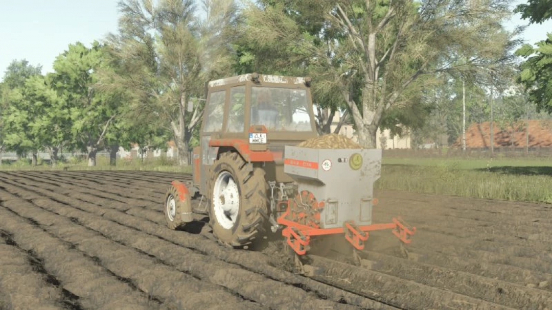 Tractor using FS25 AGROZET SA2-074 mod in Farming Simulator 25, plowing a field in a lush countryside.