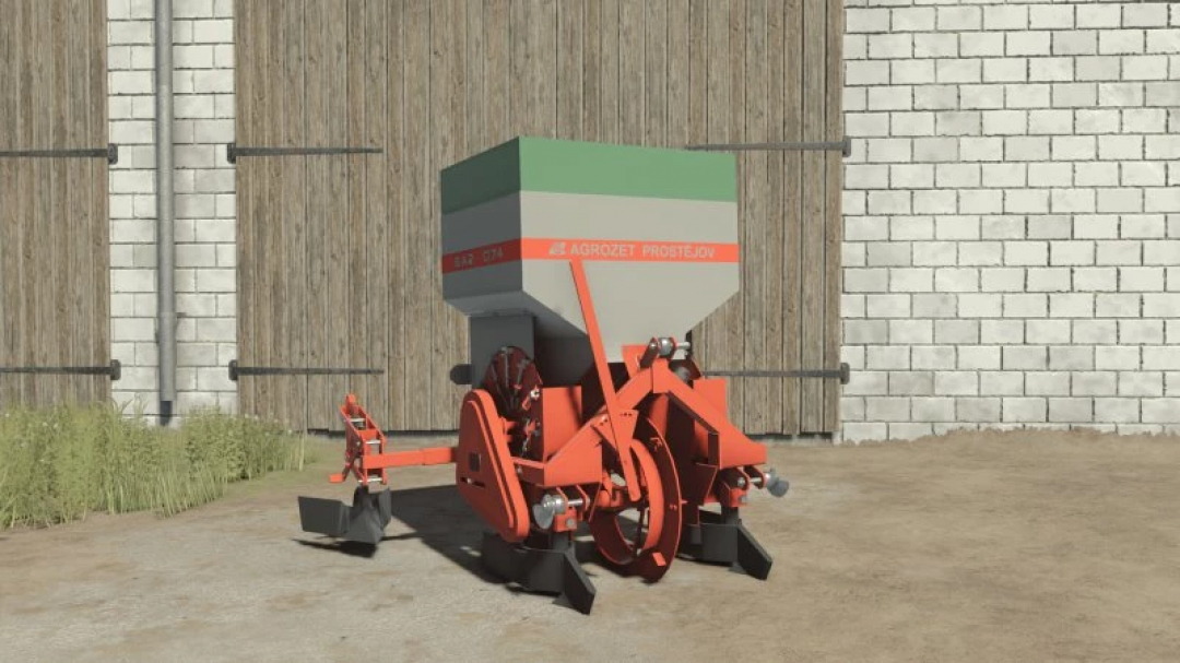 FS25 AGROZET SA2-074 v1.0.0.0 mod featuring a red and green agricultural seeder against a barn wall in Farming Simulator 25.