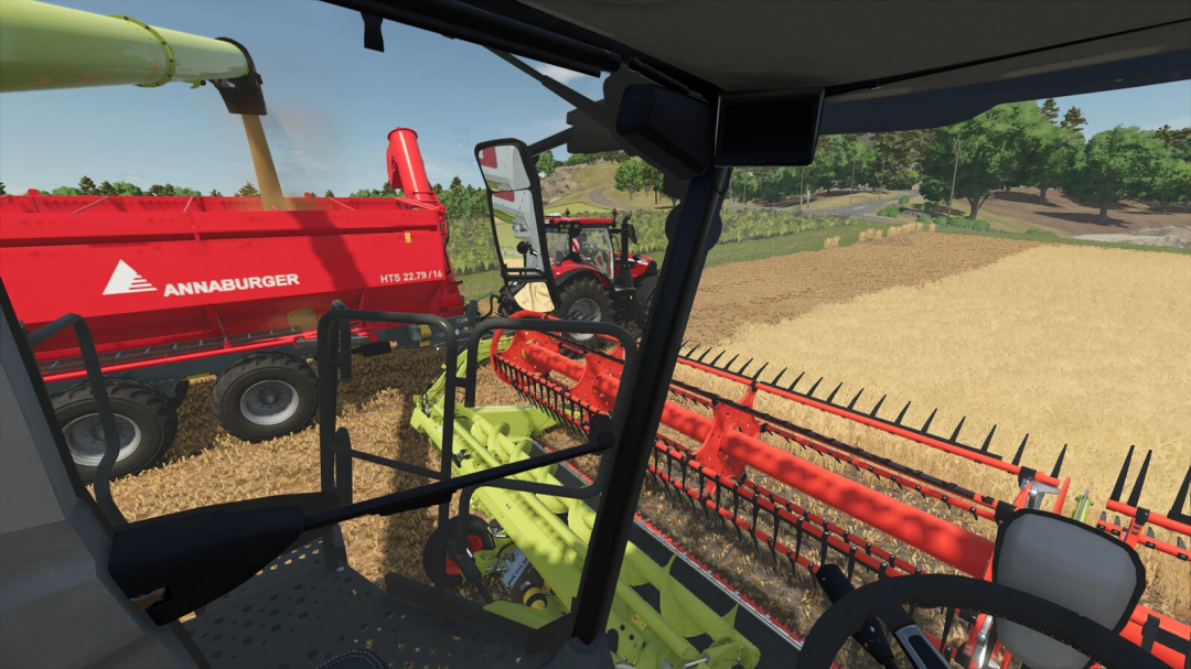 FS25 mod Filllevel Warning v1.0.0.0 showing harvest from combine to Annaburger trailer.